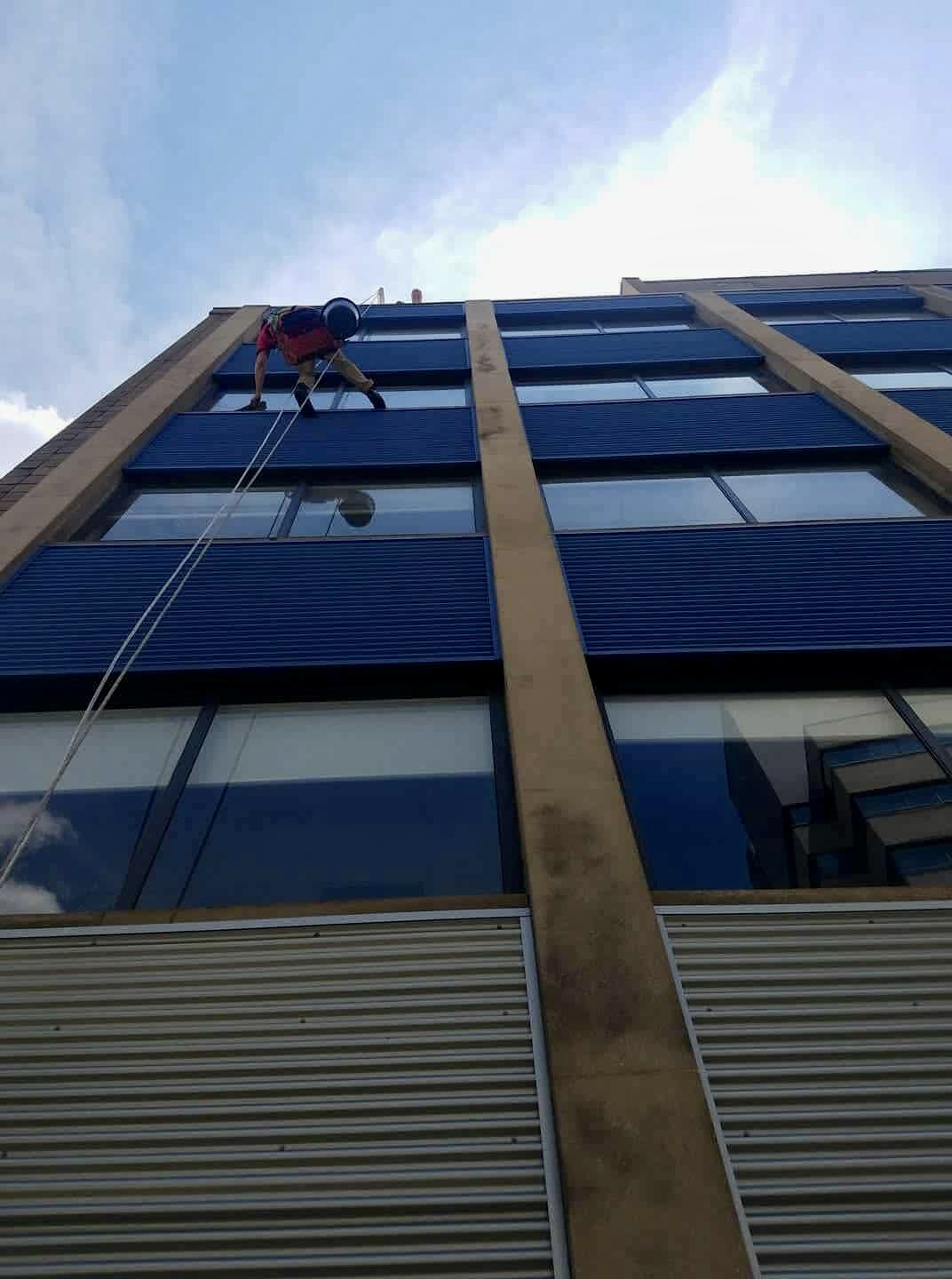 High-rise window cleaning with rope access
